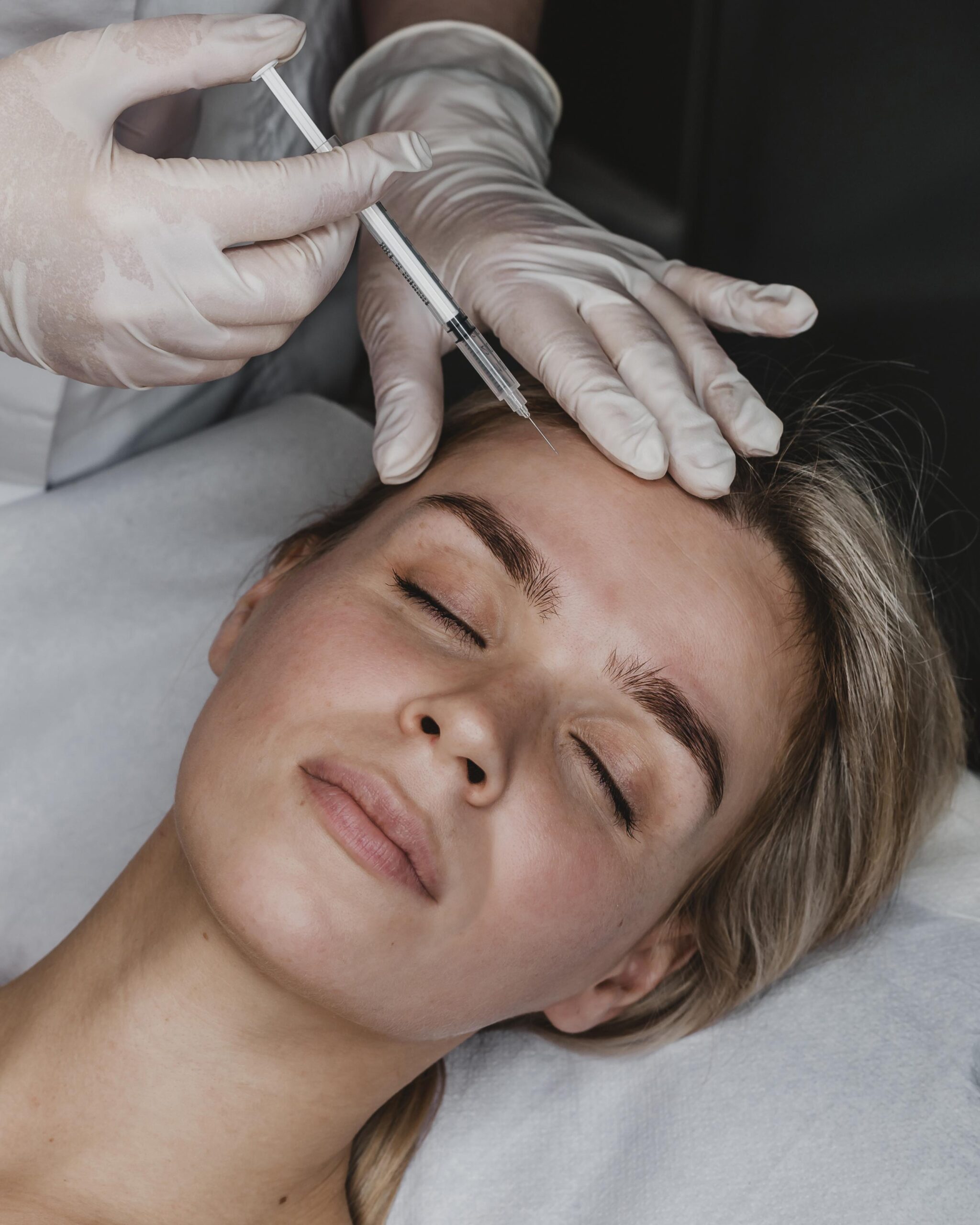 young woman getting beauty injection scaled