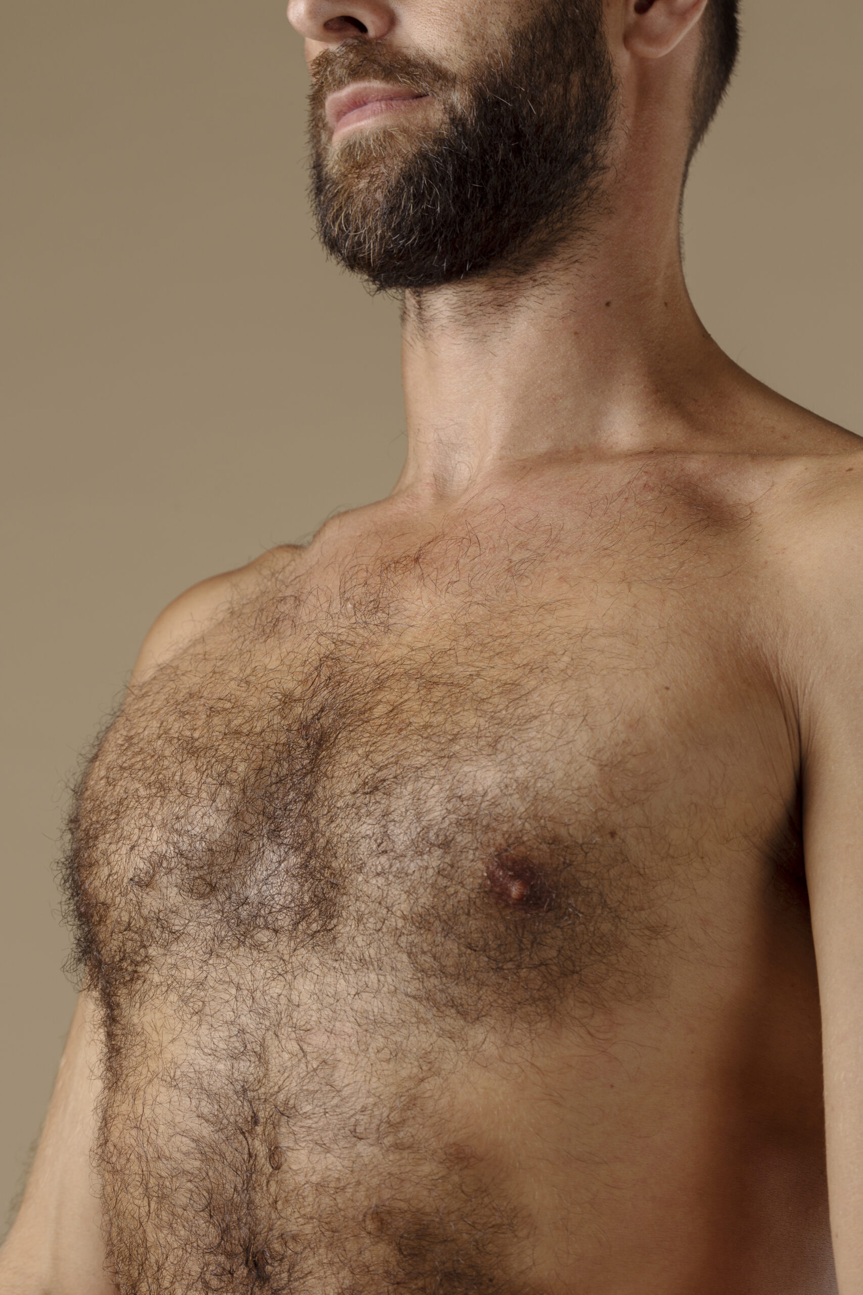 side view man with chest hair posing scaled
