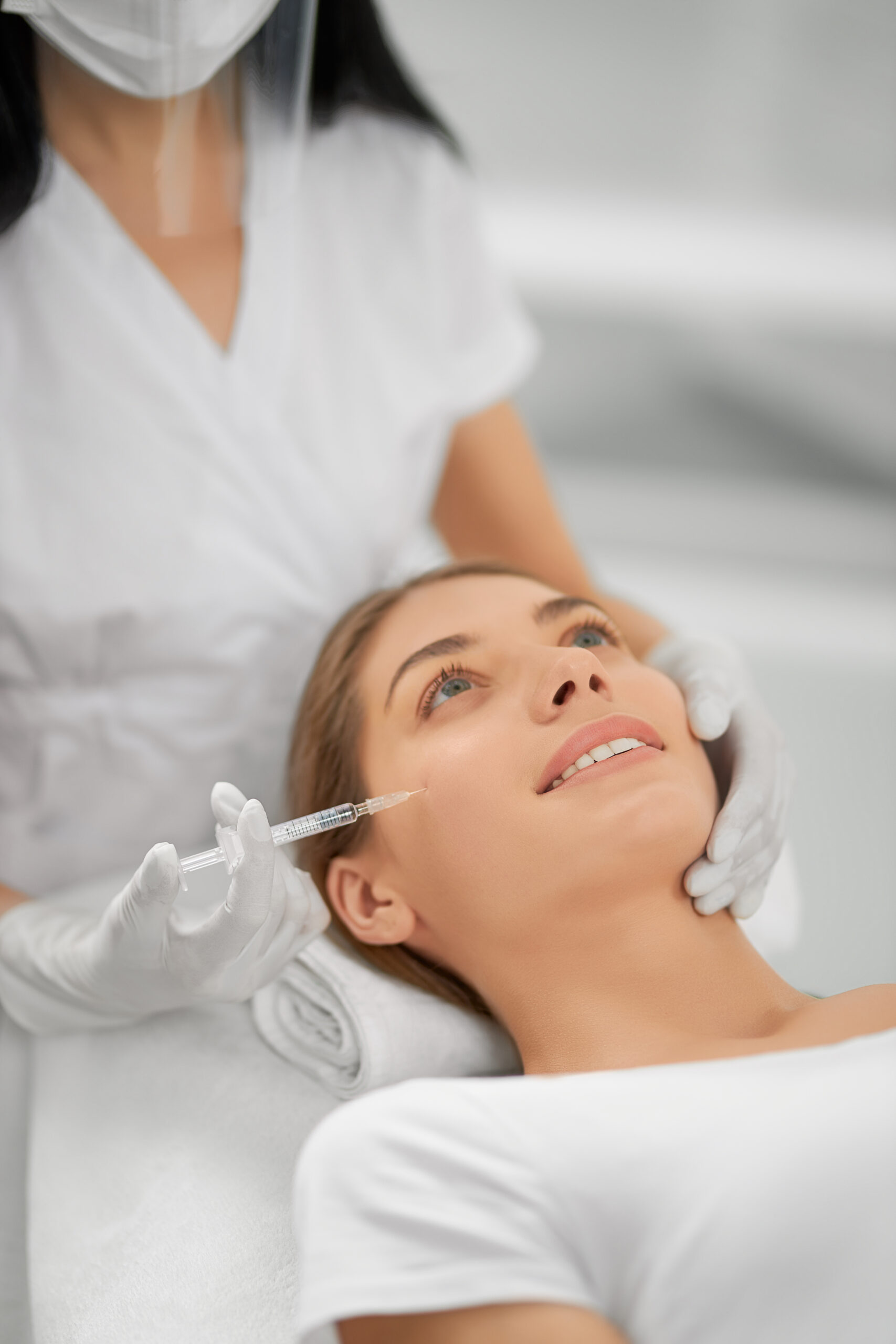 smiling woman doing procedure tighten skin scaled